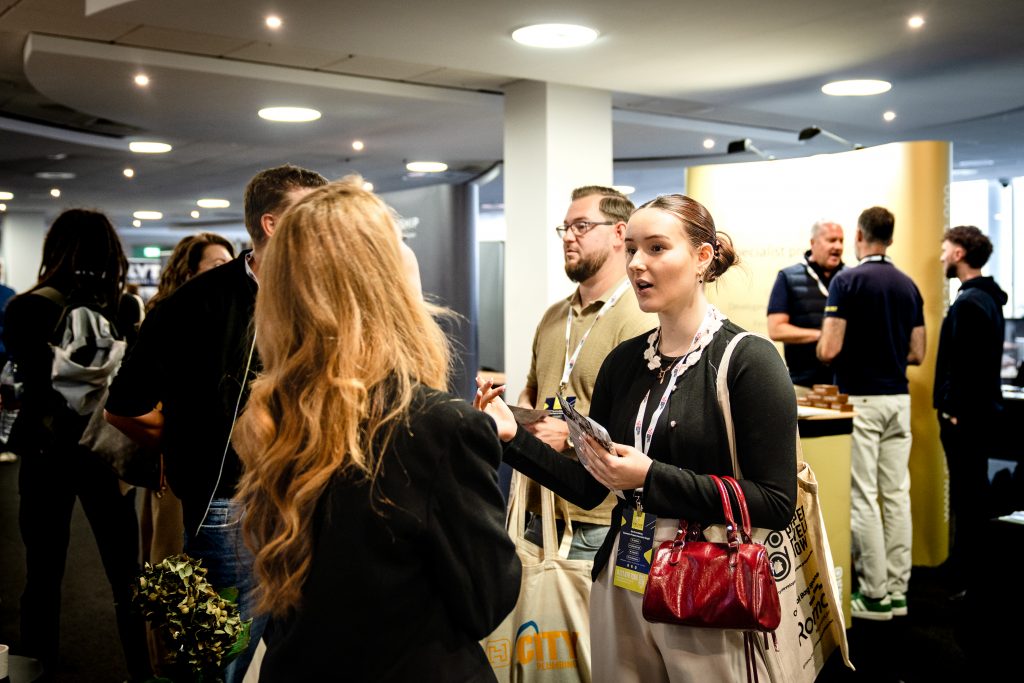 Attendees talking with exhibitors at Property Developer Show Southampton 2026